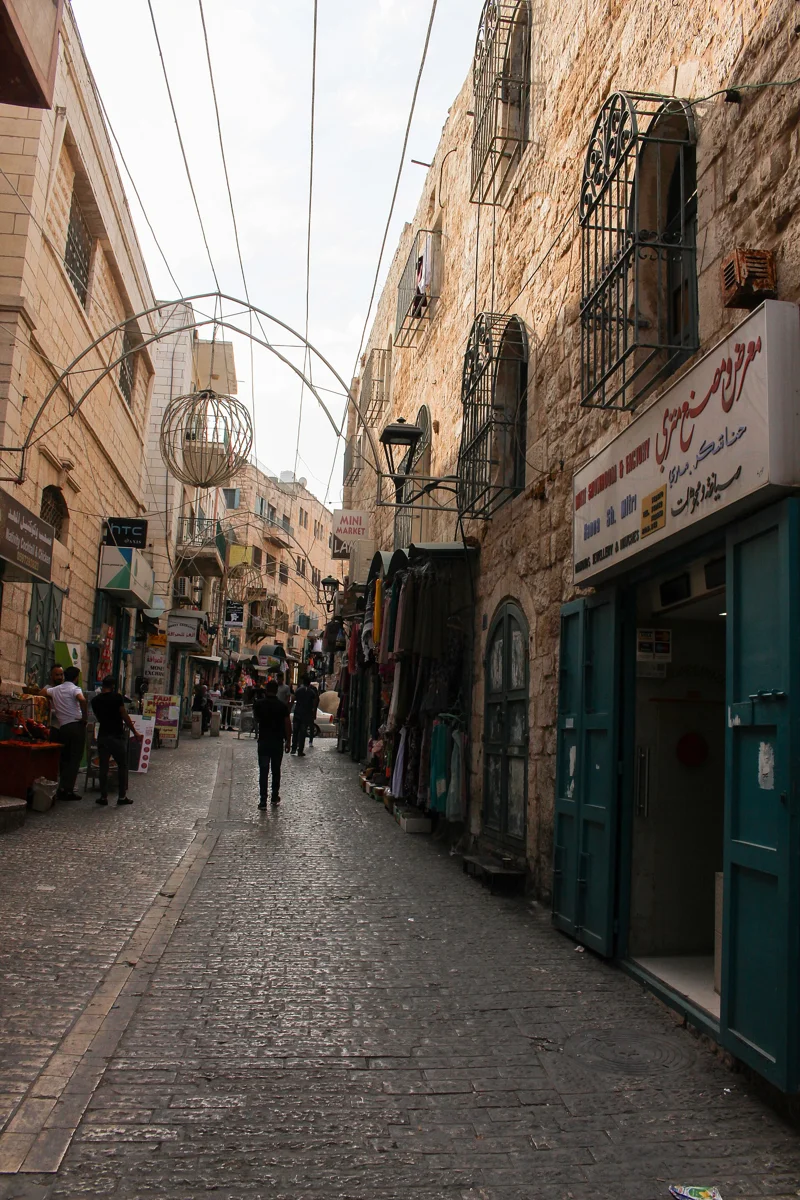 A lane in the old market of Bethlehem, a place visitors ask about when judging if it is safe to visit Bethlehem